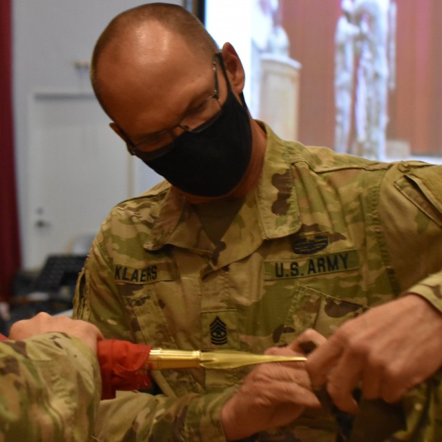 Sergeant Major William Klaers, Task Force Essayons Senior Enlisted Advisor takes the final step to casing the command colors for the final time on May 15, 2021 at Camp Arifjan, Kuwait. (Photo by Rick Benoit)