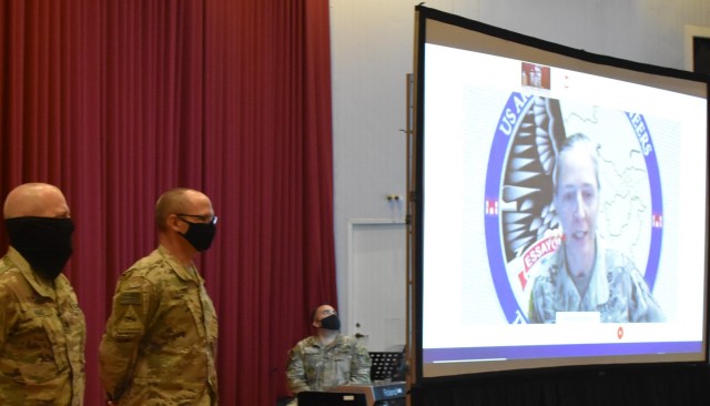Transatlantic Division&#39;s Commander, Brigadier General Kimberly Colloton presides over the ceremony on May 15, 2021 which presented Colonel John Haas Jr. and SGM William Klaers with service medals. (Photo by Rick Benoit)