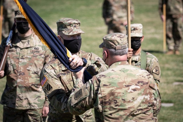 Brig. Gen. William Dyer III, center left, signifies his assumption of command by receiving the colors of the United States Army Reserve Legal Command from Lt. Gen Charles Pede, the Judge Advocate General of the United States Army, during a...