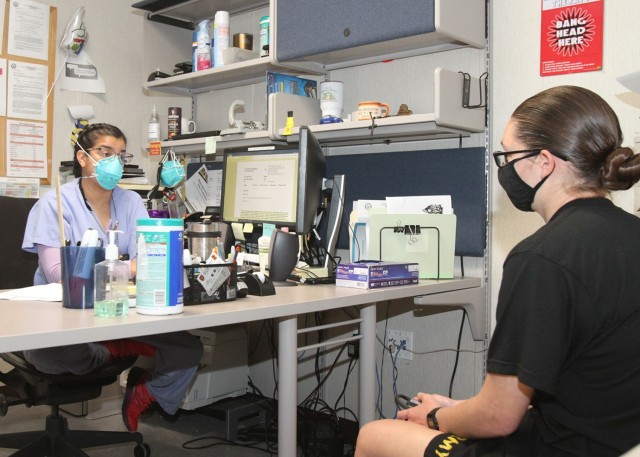 Cambria Harris, a registered nurse at the Bleak Troop Medical Clinic sees a patient in her office May 12, 2021. Daily the clinic staff sees about 100 to 150 patients and 200 to 250 during the summer surge for basic combat training.