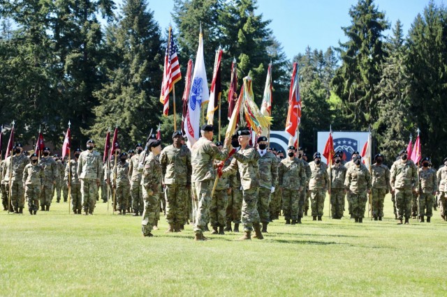 Brig. Gen. Timothy P. White, the former 593rd Expeditionary Sustainment Command commanding general, passes the ESC colors to the I Corps commanding general, Lt. Gen. Randy A. George, during the ESC change of command ceremony at Watkins Field here at Joint Base Lewis-McChord, May 14, 2021.  

“To the Soldiers, NCOs, Officers, and families of the 593rd Expeditionary Sustainment Command, I am so proud of all you,” White said.  “Your contributions to our nation are often understated, but never, ever unappreciated.”

White relinquished his position as the organization welcomed Col. Martine S. Kidd and Command Sgt. Maj. Terrence T. Scarborough as the organization’s new command team. (U.S. Army photo by Sgt. 1st Class Tony White, 593rd ESC)