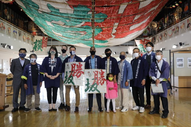 USAG Japan Commander Col. Thomas R. Matelski, USAG Japan Command Sgt. Major Justin Turner, their families, and members of the Sagami Giant Kite Preservation Association, Kassaka District, pose for a group photo at the Sagami Giant Kites Center...
