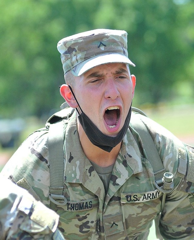 Pvt. Justin Thomas, Victor Company, 262nd Quartermaster Battalion cheers on his unit members during Dragon Brigade's Soldier Stakes Competition May 14 at Williams Stadium.