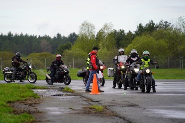 Participants lined up for the first skills station at the USAG Bavaria Motorcycle Mentorship Safety Day, May 14, 2021. Mentor coaches provided additional feedback after each maneuver was completed. (U.S. Army photo by Sidney Sullivan / USAG Bavaria Public Affairs)