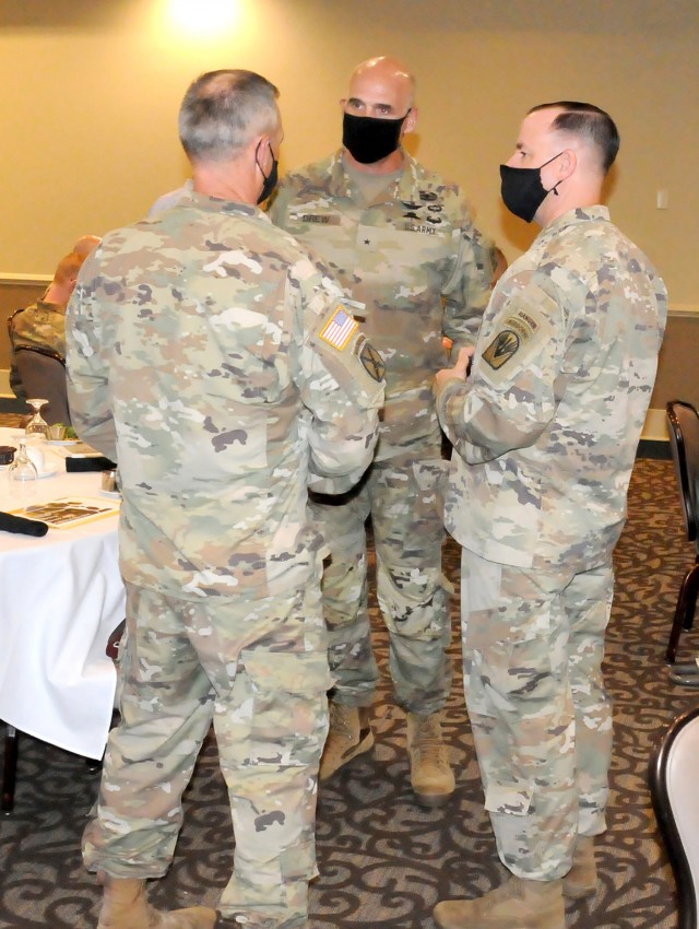 Brig. Gen. Thomas Drew, (center) director of the U.S. Army Talent Management Task Force, talks to Col. Duane Patin, (left) Joint Readiness Training Center and Fort Polk chief of staff, and Command Sgt. Maj. Michael C. Henry, (right) post command...