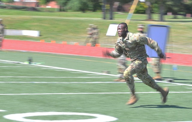 Spc. Kervins Accius, Bravo Company, 266th Quartermaster Battalion, dashes toward the halfway point of a sprint during the Dragon’s Brigade’s Soldier Stakes Competition May 14 at Williams Stadium.