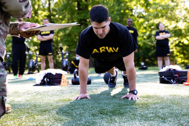 A soldier assigned to Headquarters, Headquarters Company, U.S. Army Reserve Legal Command conducts the Hand Release Push-Up-Arm Extension event of the Army Combat Fitness Test on Saturday, May 15th aboard Naval Support Activity Bethesda, Maryland.  The multi-event test served as a diagnostic evaluation of each Soldier’s physical readiness while providing a viewpoint on how they can improve their training and nutrition.