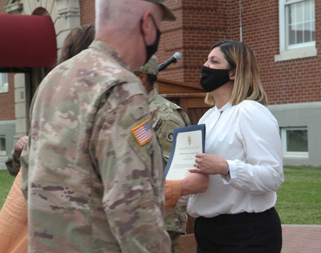 Mrs. Beatriz Medina, executive administrative specialist, 1st Theater Sustainment Command,  receives the Certificate of Appreciation from Maj. Gen. John Sullivan, commanding general, 1st TSC, at Fort Knox, Kentucky, May 14, 2021. (U.S. Army photo...