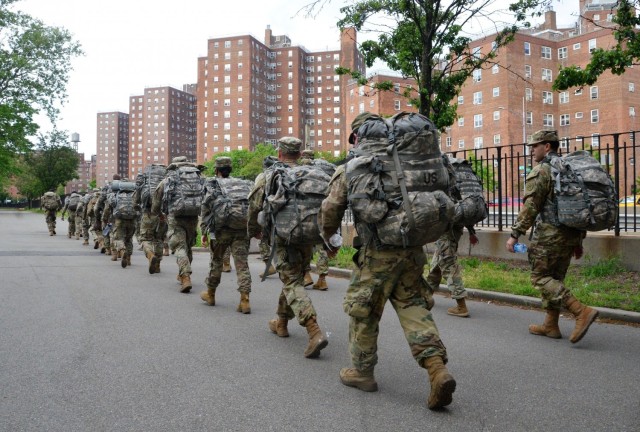 New York Army National Guard medics assigned to the Headquarters Company of the 1st Battalion, 69th Infantry Regiment conduct a six mile ruck march through Manhattan during the early morning hours on May 16, 2021. Thirty-six medics took part in...