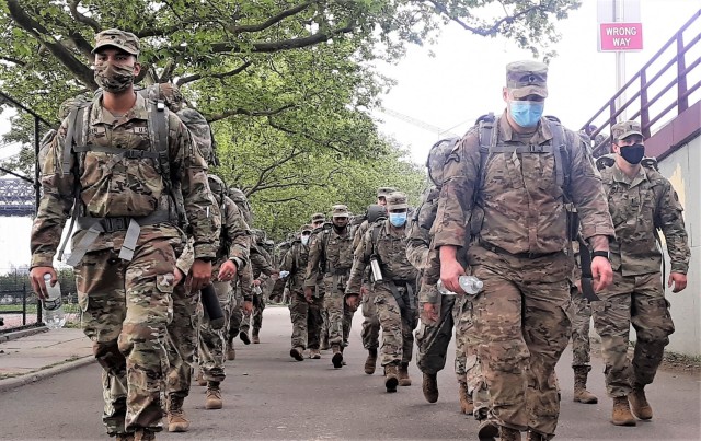 New York Army National Guard Soldiers assigned to the Headquarters Company of the 1st Battalion, 69th Infantry Regiment conduct a six mile ruck march through Manhattan during the early morning hours on May 16, 2021. Thirty Soldiers from the...