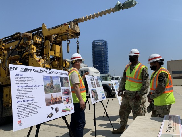 Song Hyo Pak, Geology and Hydrology Section chief, briefs 11th Engineer Battalion Soldiers on the capabilities of drilling rigs, water well maintenance and sampling, at the motor pool, during a visit to Far East District, May 13. (U.S. Army photo by Sameria Zavala)