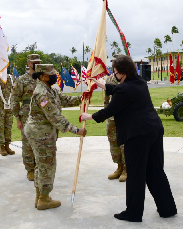 IMCOM – Readiness Director, Brenda Lee McCullough passes the garrison colors to incoming Garrison Commander, Col. Tomika M. Seaberry, signifying Seaberry’s assumption of command of Fort Buchanan.