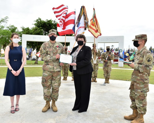 Director of Installation Management Command (IMCOM) – Readiness, Ms. Brenda Lee McCullough presented Col. Corcoran with the Legion of Merit “for exceptionally Meritorious Service as a Garrison Commander… having significantly  improved the...