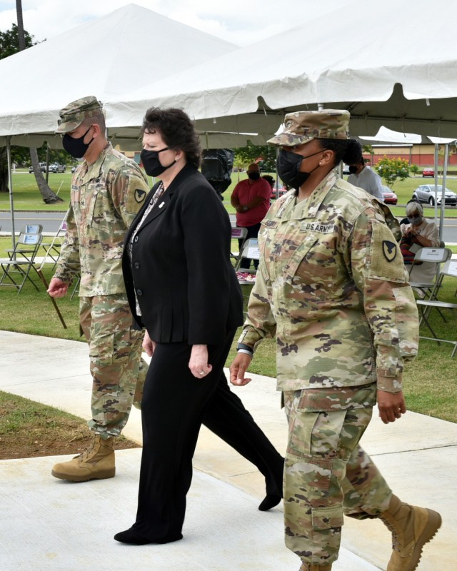 The official party for the change of command, outgoing Garrison Commander, Col. Joseph B. Corcoran III; IMCOM – Readiness Director, Brenda Lee McCullough and incoming Garrison Commander, Col. Tomika M. Seaberry proceed to conduct the ceremony.
