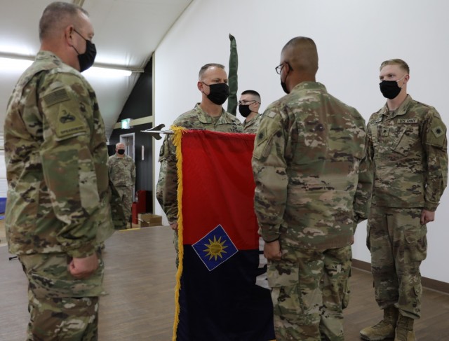 Task Force Phoenix Command Chief Warrant Officer 5 Rich Huber, Commander Col. Alan Gronewold and Command Sgt. Maj. Refugio Rosas uncase the 40th Combat Aviation Brigade&#39;s colors during a Transfer of Authority ceremony at Camp Buehring, Kuwait. The guidon bearers are Sgt. Dominic Caccese from the 28th Expeditionary Combat Aviation Brigade and Spc. Kenneth Center from the 40th CAB. The uncasing of the colors marks the official beginning of the mission for Task Force Phoenix in the Middle East.