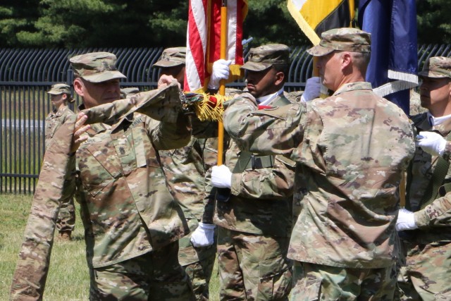 Fort A.P. Hill, Virginia - Maj. Gen. John M. Rhodes and Command Sgt. Maj. Daryl Plude, the 29th Infantry Division command team, case their organizational colors signifying the official start of the unit&#39;s federal active duty mission May 15, 2021, in Bowling Green, Virginia. 