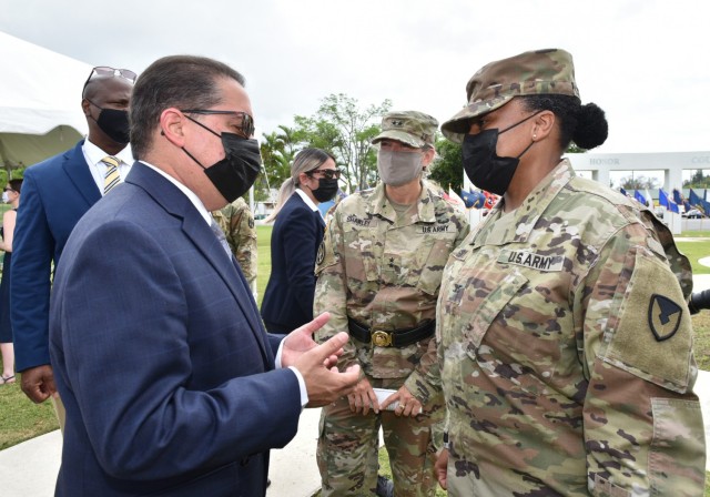 Incoming Garrison Commander, Col. Tomika M. Seaberry speaks with President of the PR Senate, Hon. José Luis Dalmau Santiago, as well as welcoming other distinguished guests to the Fort Buchanan Change of Command Ceremony.