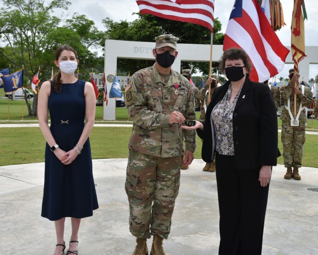 Director of Installation Management Command (IMCOM) – Readiness, Ms. Brenda Lee McCullough presented Col. Corcoran with her Coin of Excellence for a job well done.