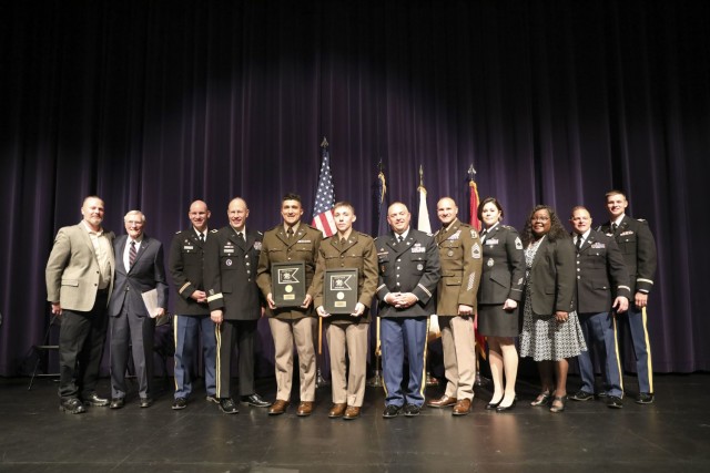 WICHITA, Kan. – The official party, graduates and current and former staff of the Wichita State University Army Reserve Officer Training Corps celebrate the commissioning of the program’s first two Army officers in nearly 30 years May 14....