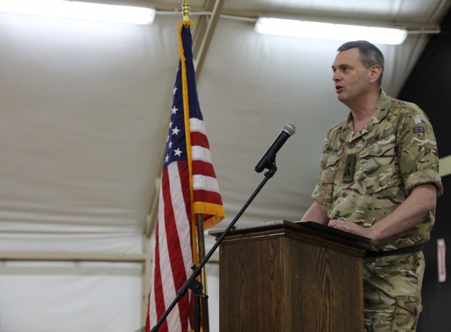 Brigadier Richard Bell, Deputy Commanding General for Combined Joint Task Force-Operation Inherent Resolve addresses Soldiers of the 28th Expeditionary Combat Aviation Brigade and the 40th Combat Aviation Brigade during a Transfer of Authority ceremony at Camp Buehring, Kuwait.