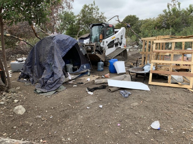 A tracked skid loader gathers debris, May 10, 2021, from the riverbed below the Santa Fe Dam in Irwindale, California. The U.S. Army Corps of Engineers District’s Operations Division is responsible for the operation and maintenance of flood risk...