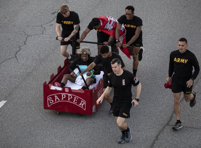 Dogface Soldiers assigned to 9th Brigade Engineer Battalion, 2nd Armored Brigade Combat Team, 3rd Infantry Division, push their battalion’s bed during the Bed Race of Marne Week 2021 on Fort Stewart, Georgia, May 17, 2021. The bed race kicks off...