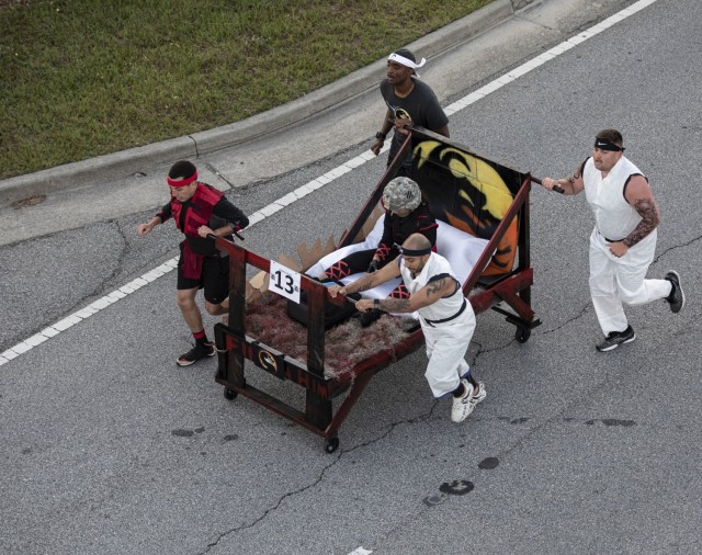 Soldiers assigned to Fort Stewart’s U.S. Army Medical Department Activity push their unit’s bed during the Bed Race of Marne Week 2021 on Fort Stewart, Georgia, May 17, 2021. The bed race kicks off this Marne Week, standing in as a fun...