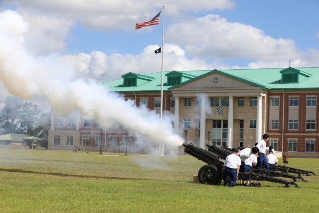 Soldiers assigned to 1st Battalion, 9th Field Artillery Regiment, fire cannons in salute during the Cashe Garden dedication ceremony for Sgt. 1st Class Alwyn Cashe on Fort Stewart, Georgia, May 20th, 2021. During Marne Week, the Division dedicated the Sgt. 1st Class Alwyn C. Cashe Garden to honor the Dogface Soldier, leader and Silver Star Medal recipient, and to inspire others to emulate his example.(U.S. Army photo by Staff Sgt. Prosper Ndow)