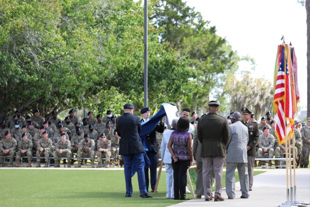 The family of Sgt. 1st Class Alwyn C. Cashe unveils the dedication plaque during the Cashe Garden dedication ceremony on Fort Stewart, Georgia, May 20th, 2021. During Marne Week, the Division dedicated the Sgt. 1st Class Alwyn C. Cashe Garden to...