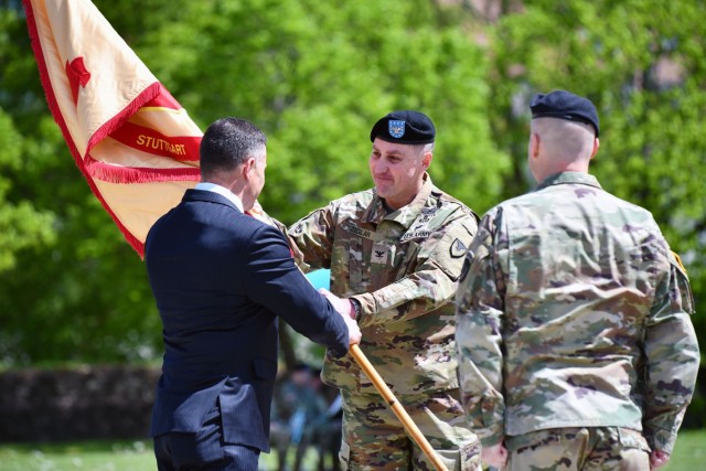 IMCOM-Europe Director Tommy R. Mize passes the U.S. Army Garrison Stuttgart colors to Col. Matt Ziglar, symbolizing the transfer of command. Photo by Jason Johnson