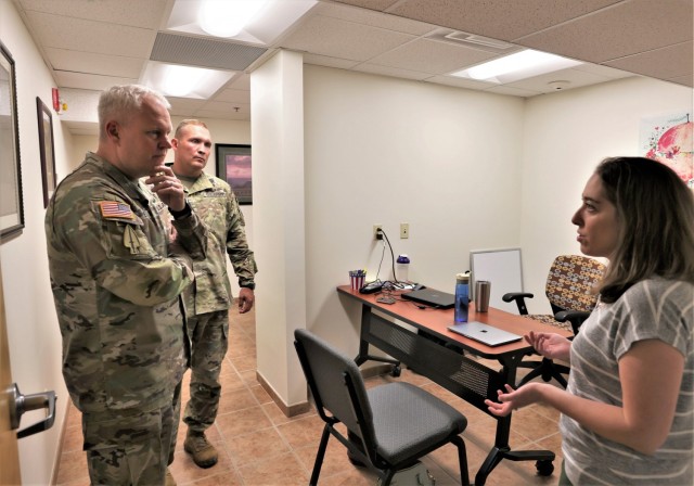 Maj. Gen. John Evans Jr. listens to suggestions from Army spouses like Jessica Hall regarding ways Fort Knox can continue to improve its new military spouse co-work space.
