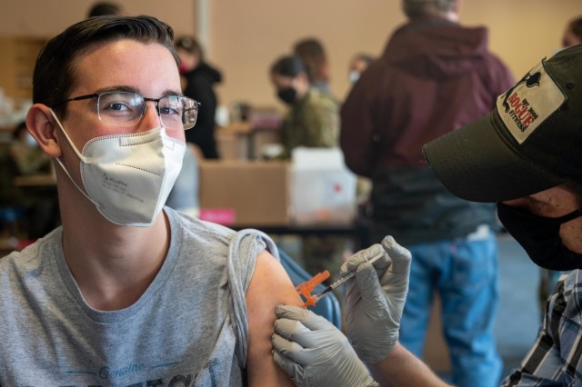 Christian Fischer, 15, receives his COVID-19 vaccine at Patch Barracks, near Stuttgart, Germany, May 22, 2021.