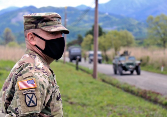 Col. Thomas J. Verell, Jr., Japan Engineer District commander, takes in a JGSDF convoy as the JGSDF members practice counter IED measures at Kita Fuji, May 15. The exercise is designed to help Central Readiness Regiment engineers prepare for...