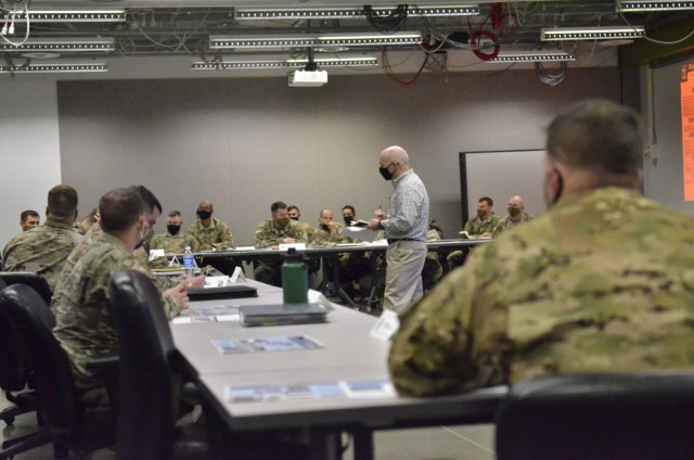 John Watson, chief, Training Division, Directorate of Plans, Training, Mobilization and Security, takes notes May 13 as Soldiers provide feedback during a Training Support Services Innovation Forum hosted at Kinnard Mission Training Complex.