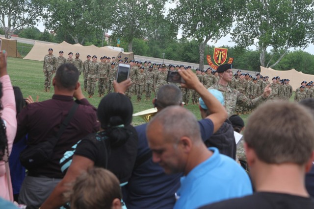 Warrant Officer Richard Townes, 77th Army Band commander, conducts ceremonial music as part of the standing room only crowd of families observe the basic combat training graduation. The May 21, 2021, ceremony was the first that families were...