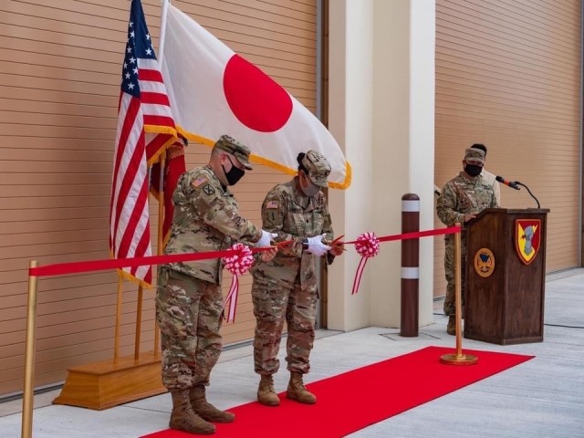 Col. Thomas J. Verell, Japan District, U.S. Army Corps of Engineers commander, and Lt. Col. Rosanna Clemente, 1st Battalion, 1st Air Defense Artillery Regiment commander, cut the ribbon during the Patriot Missile Storage Facility ribbon-cutting ceremony to celebrate the unveiling of the first MSF at Kadena Air Base, Japan May 19, 2021.