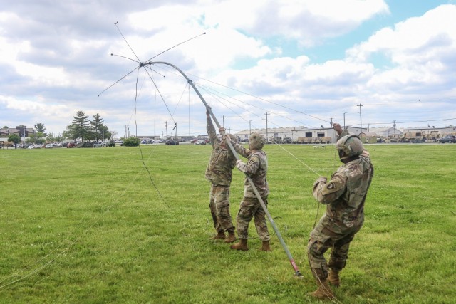 U.S. Army Soldiers from 1st Battalion, 327th Infantry Regiment “Above the Rest,” 1st Brigade Combat Team, 101st Airborne Division (Air Assault), set up an OE-254 Antenna during the Best Communicators Competition during Bastogne Week May 5 on Johnson Field on Fort Campbell, Ky. Bastogne Week is a week-long competitive event building esprit de corps and pride within the unit. (U.S. Army photo by Maj. Vonnie Wright, 1st Brigade Combat Team Public Affairs)