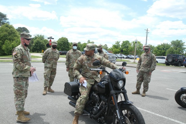 Soldiers of the 1st Theater Sustainment Command get their motorcycles inspected to ensure they meet all state and installation safety requirements for operation at Fort Knox, Kentucky, May 13, 2021. May is Motorcycle Safety Awareness Month and it is important for Soldiers to wear the prescribed personal protective equipment and practice safe riding habits to ensure individual and unit readiness. (U.S. Army photo by Staff Sgt. Nahjier Williams, 1st TSC public affairs.