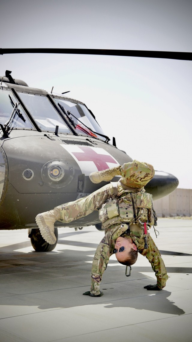 Staff Sgt. Brianna Pritchard, an Army National Guard UH-60 Black Hawk helicopter mechanic from Anchorage, Alaska, shows her Olympic breaking moves at Al Asad Air Base, Iraq.           