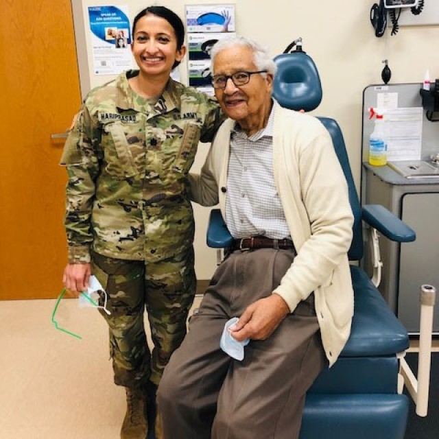 Army Lt. Col. Deepa Hariprasad poses for a photo with Charles McGee sometime in 2020 at Walter Reed National Military Medical Center, Md. McGee is one of the last living members of the Tuskegee Airmen.