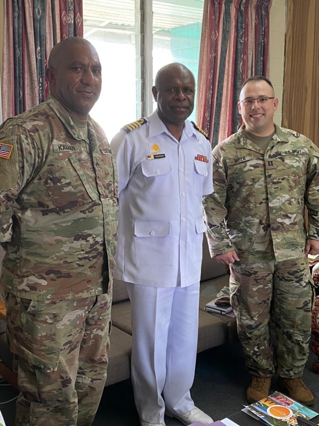 Task Force Oceania’s Pacific Augmentation Team for Papua New Guinea, Cpl. Louie Kaman, Cultural Liaison Officer (left) and Capt. Christopher Meza, officer-in-charge (right) pose for a picture with the Capt. Philip Polewara, chief-of-staff of the Papua New Guinea Defense Force. Task Force Oceania builds trust by implementing a Task Force composed and tailored specifically for the region. The task force consists of a headquarters and 2-Soldier teams comprised of Soldiers from all components; Active Duty, Army Reserve and National Guard. These civil affairs teams deploy to various Pacific island countries and provide continuous support throughout Oceania with a primary mission to assist the State Department in the planning and execution of both military and civilian engagements throughout the region.