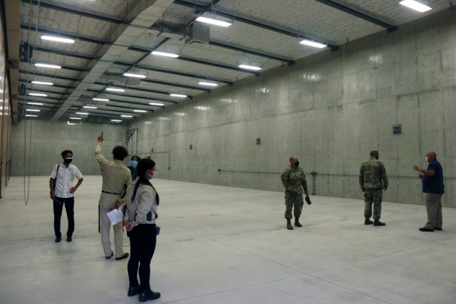 Col. Thomas J. Verell, Jr., is given a tour of the newly opened Patriot Missile Storage Facility in Okinawa, Japan. The facility has massive vaults able to store multiple batteries of missiles, available at a moments notice.