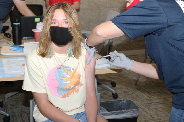 Indrie Friday, 13, daughter of Sgt. 1st Class Joshua Friday, an observer, coach and trainer with Cobra Team, Operations Group, receives the Pfizer COVID-19 vaccine May 15 at the Dr. Mary E. Walker Center on Fort Irwin, Calif. Indrie was the first...
