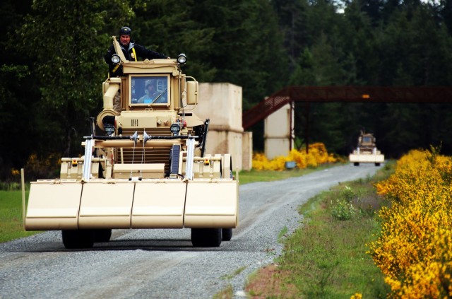 Soldiers with Bravo Company, 898th Brigade Engineer Battalion train with the Husky Vehicle Mounted Mine Detector May 19, 2021, at Joint Base Lewis-McChord. 