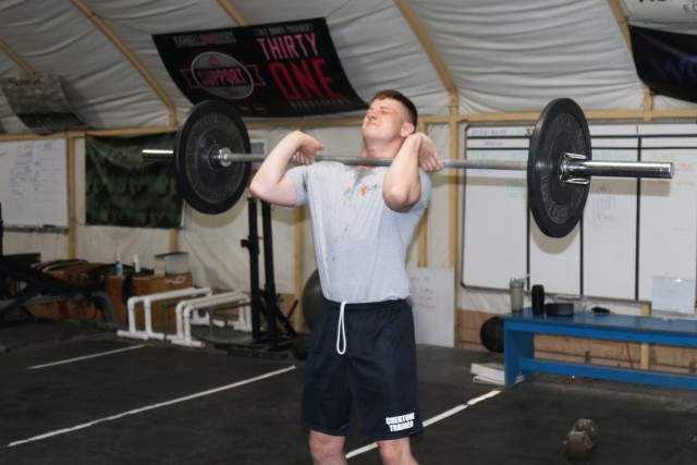 PFC Kaleb Creamer works out at The Diamond Mine gym on Camp Buehring, Kuwait. The Diamond Mine provides the 111th Theater Engineer Brigade Soldiers with the necessary conditions and opportunity to meet their physical potential. The Diamond Mine offers a variety of structured blocks of time dedicated to improving fitness and general wellbeing, as well as open gym hours daily.