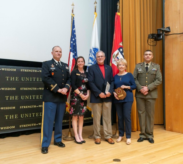 John Tisserand and his, wife, Jeanie stand between Class Vice President and Bulgarian Lt. Col. Ivaylo Ivanov to right and Col. Brian Henderson, director of the International Fellows Program, and Ashlea Cordell - Lowe, Sponsorship Coordinator to the left