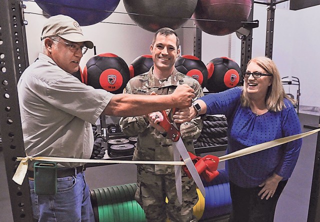 From left: Rick St. Cyr, Directorate of Public Works Project Management Branch project director, Col. Jeff Paine, U.S. Army Garrison Fort Leonard Wood commander, and Megan O’Donoghue, Family and Morale, Welfare and Recreation director, clip the...