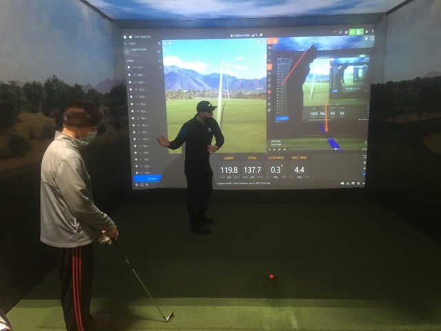 Maj. Scott Robison (left), a Soldier assigned to the Fort Carson Soldier Recovery Unit, Colo., participated in an indoor golf program taught by Professional Golfers’ Association Coach Leighton Smith (right). The six-week program is offered by...