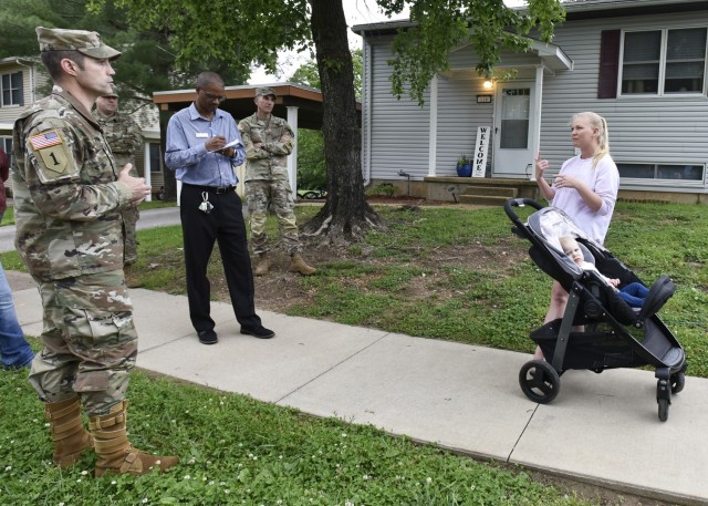 From left: Col. Jeff Paine, U.S. Army Garrison Fort Leonard Wood commander; Jason Williams, community manager; and Col. Adam Hilburgh, 3rd Chemical Brigade commander and neighborhood sponsor, speak with on-post resident Katie Cichorz during a walking town hall May 19 through the Piney Hills neighborhood here. 