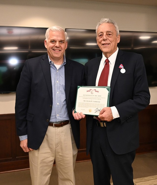 Left, Under Secretary of the Army Christopher Lowman visited Tobyhanna Army Depot May 20 to present the Department of the Army Superior Civilian Service Medal to Frank Zardecki, depot deputy commander.